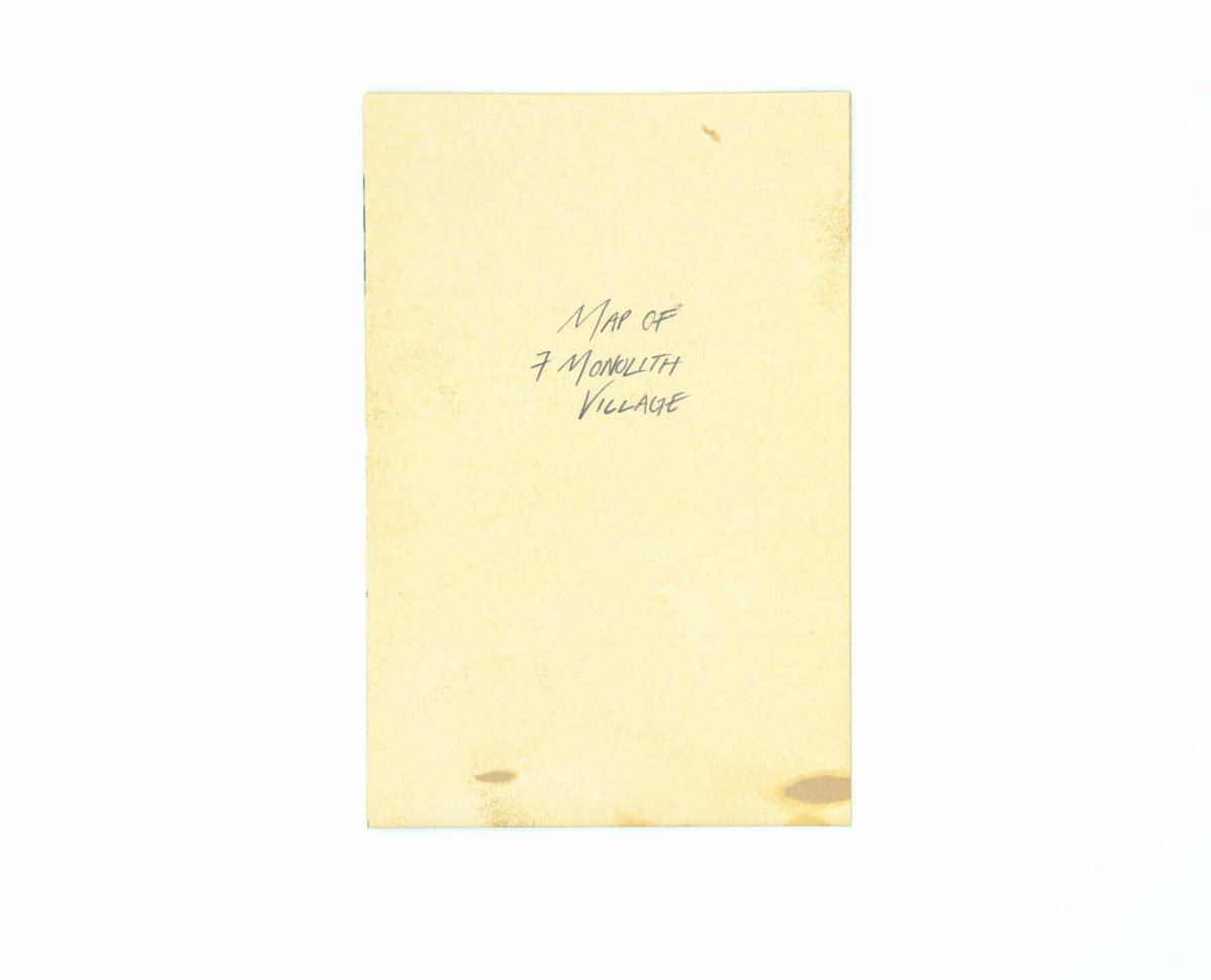 yellow tattered booklet with the words 